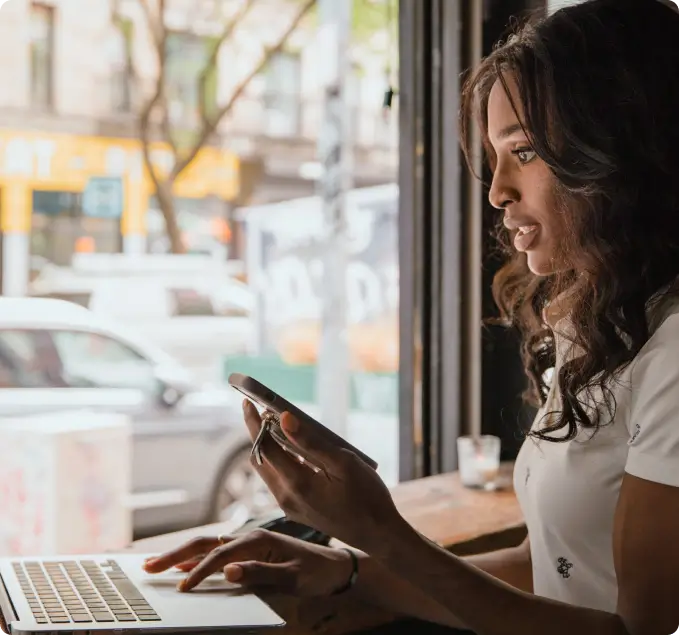 Woman smiling using WeWire Africa to transfer money accross continents for her business
